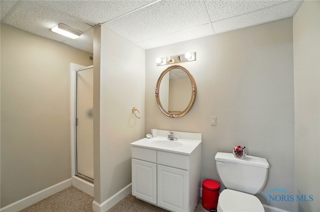 7433 Valhalla Dr, Maumee, OH 43537 - bathroom featuring vanity, a shower stall, baseboards, toilet, and a paneled ceiling
