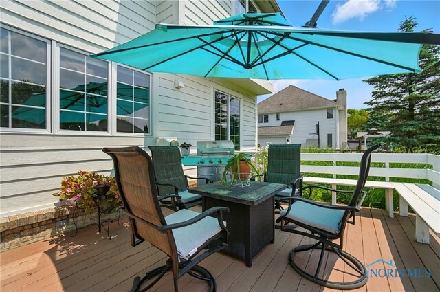 7433 Valhalla Dr, Maumee, OH 43537 - wooden deck with a grill and outdoor dining area