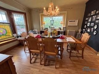 443 E 4th St, Ottawa, OH 45875 - dining room featuring a chandelier, healthy amount of natural light, and wood finished floors