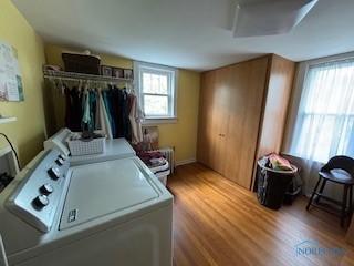 443 E 4th St, Ottawa, OH 45875 - laundry room featuring washer and clothes dryer and wood finished floors