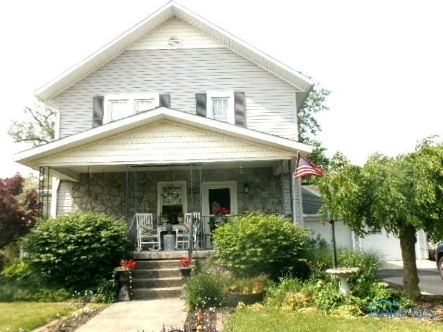 443 E 4th St, Ottawa, OH 45875 - view of front of property featuring a porch and stone siding