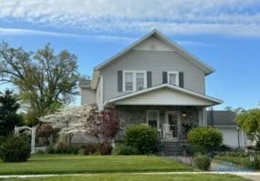 443 E 4th St, Ottawa, OH 45875 - view of front of house with a front lawn and a porch
