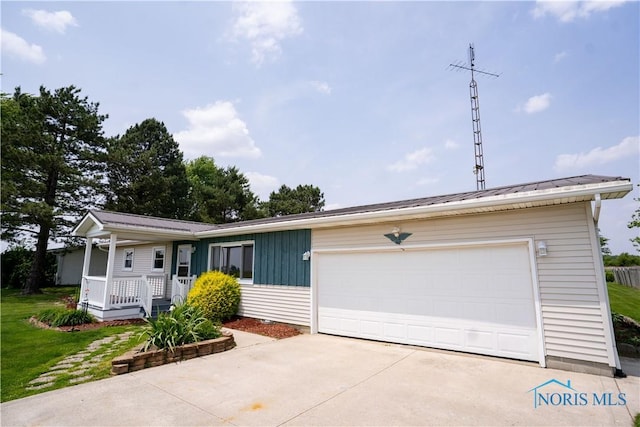 15480 State Route 18, Holgate, OH 43527 - single story home with a porch, a garage, metal roof, and driveway