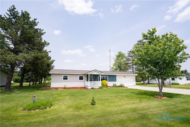 15480 State Route 18, Holgate, OH 43527 - ranch-style house featuring concrete driveway, a garage, a front yard, and metal roof