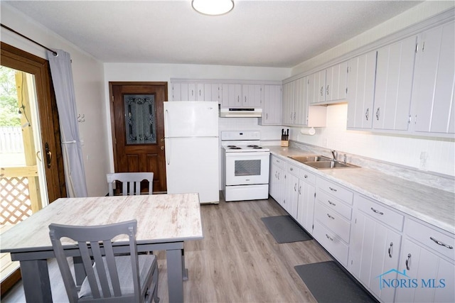 15480 State Route 18, Holgate, OH 43527 - kitchen with white appliances, range hood, a sink, light countertops, and light wood-style floors