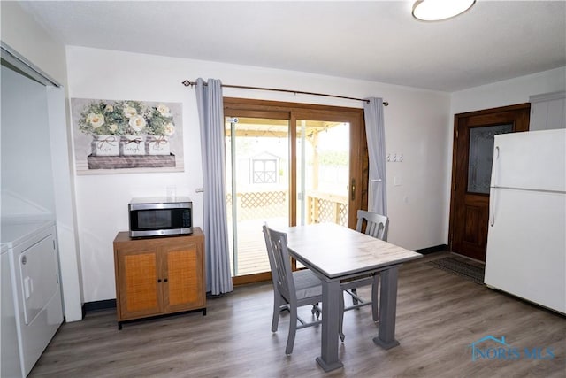 15480 State Route 18, Holgate, OH 43527 - dining space with washer and clothes dryer and light wood finished floors