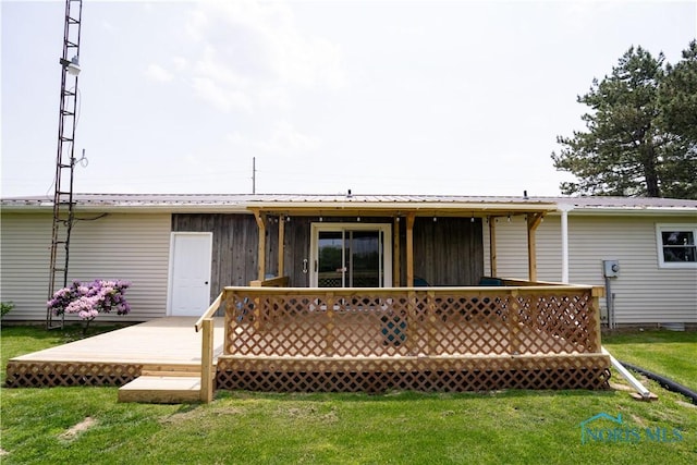 15480 State Route 18, Holgate, OH 43527 - back of house with a wooden deck, a lawn, metal roof, and board and batten siding