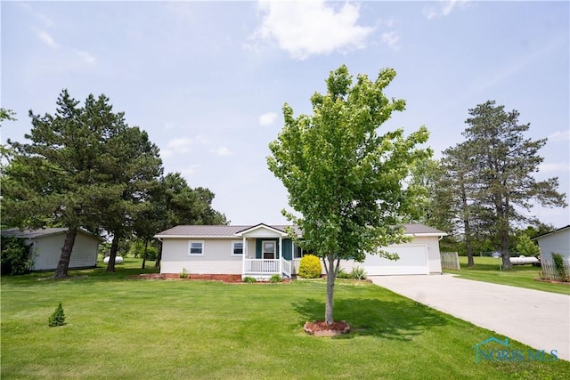 15480 State Route 18, Holgate, OH 43527 - view of front facade featuring covered porch, driveway, a front lawn, metal roof, and an attached garage