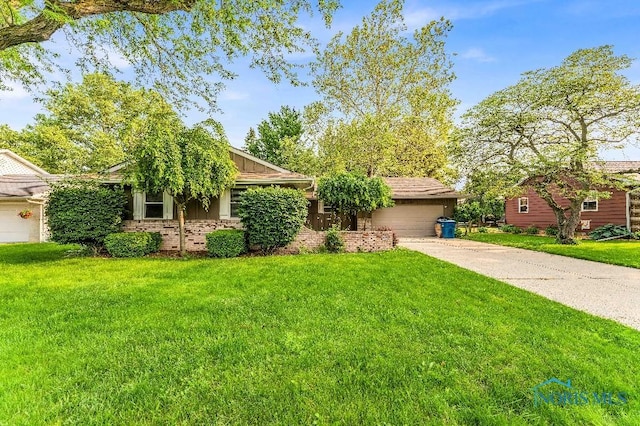 838 Liberty Dr, Waterville, OH 43566 - view of front of property featuring concrete driveway, a garage, and a front lawn