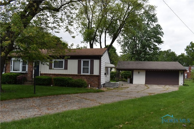 38 N Melody Ln, Waterville, OH 43566 - view of front of property with brick siding, a garage, an outbuilding, and a front yard