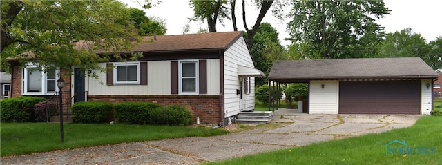 38 N Melody Ln, Waterville, OH 43566 - ranch-style house featuring brick siding, a garage, an outdoor structure, and a shingled roof