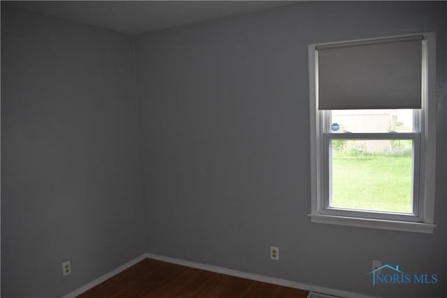 38 N Melody Ln, Waterville, OH 43566 - empty room featuring dark wood finished floors and baseboards