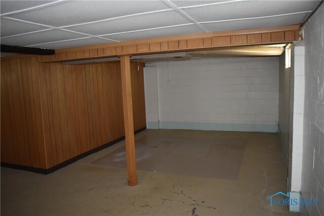 38 N Melody Ln, Waterville, OH 43566 - finished below grade area with wood walls, a drop ceiling, and concrete block wall