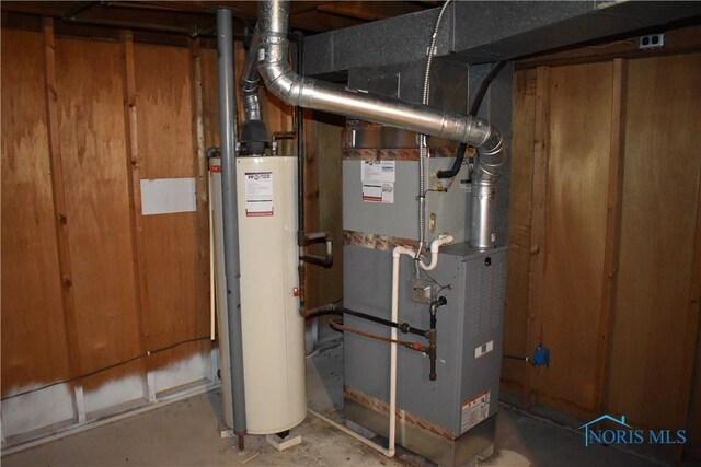 38 N Melody Ln, Waterville, OH 43566 - utility room with gas water heater and heating unit