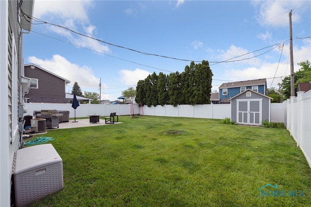 2546 Redfox Dr, Toledo, OH 43611 - view of yard featuring a patio area and central air condition unit