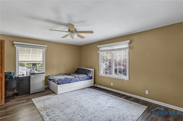700 Franklin Ave, Findlay, OH 45840 - bedroom featuring wood finished floors, baseboards, and ceiling fan