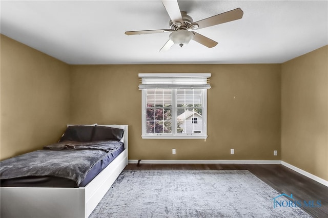 700 Franklin Ave, Findlay, OH 45840 - bedroom featuring baseboards, wood finished floors, and ceiling fan