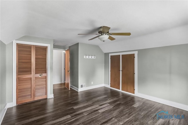 700 Franklin Ave, Findlay, OH 45840 - unfurnished bedroom with lofted ceiling, dark wood finished floors, baseboards, and ceiling fan