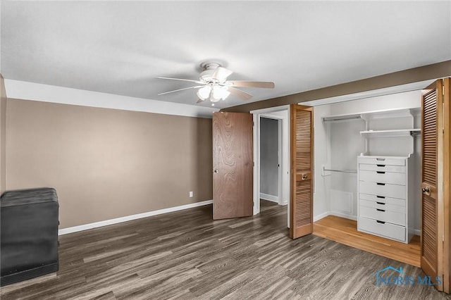 700 Franklin Ave, Findlay, OH 45840 - unfurnished bedroom featuring a closet, baseboards, wood finished floors, and ceiling fan