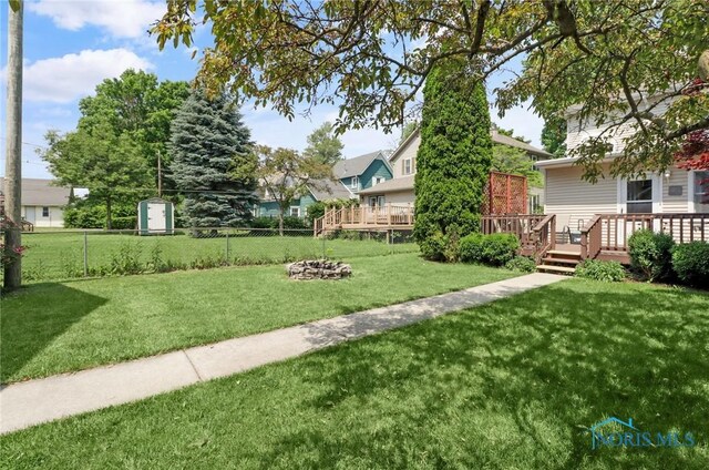 700 Franklin Ave, Findlay, OH 45840 - view of yard with a wooden deck and an outdoor fire pit