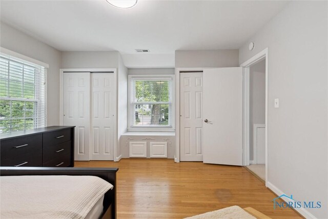 2829 Pembroke Rd, Ottawa Hills, OH 43606 - bedroom featuring multiple closets and light wood-style floors