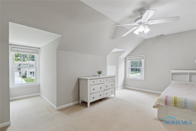 2829 Pembroke Rd, Ottawa Hills, OH 43606 - bedroom with multiple windows, light carpet, lofted ceiling, and baseboards