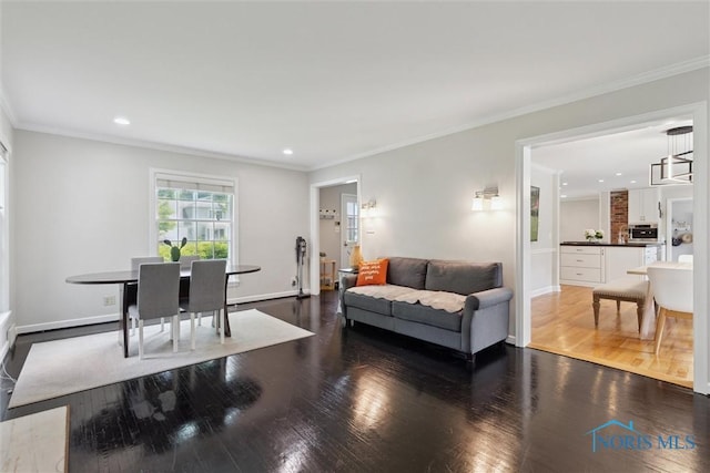 2829 Pembroke Rd, Ottawa Hills, OH 43606 - living area featuring wood finished floors, recessed lighting, ornamental molding, and baseboards