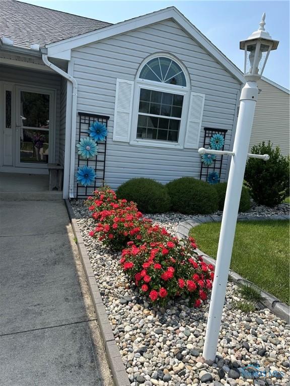 1245 Countryside Dr, Findlay, OH 45840 - view of property exterior with roof with shingles