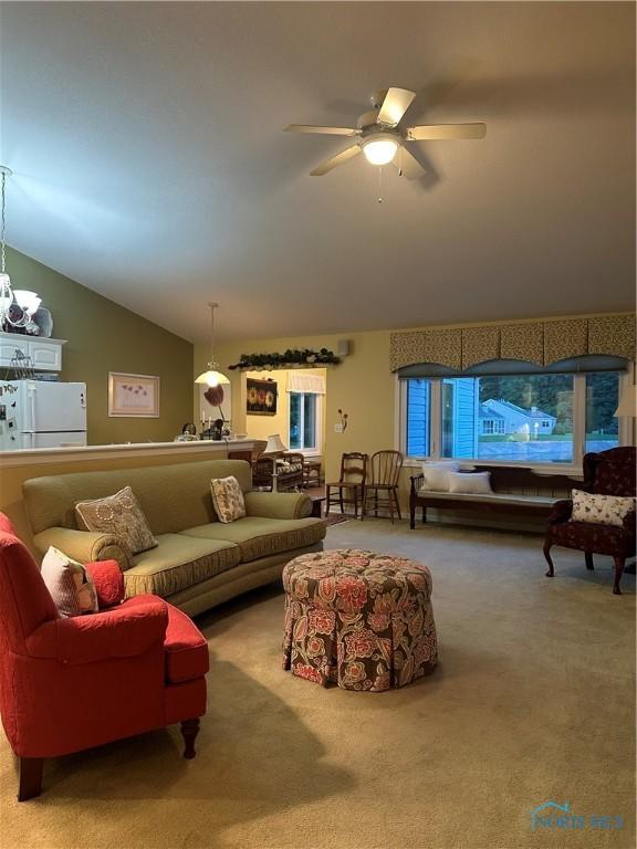 1245 Countryside Dr, Findlay, OH 45840 - carpeted living room with vaulted ceiling and a ceiling fan