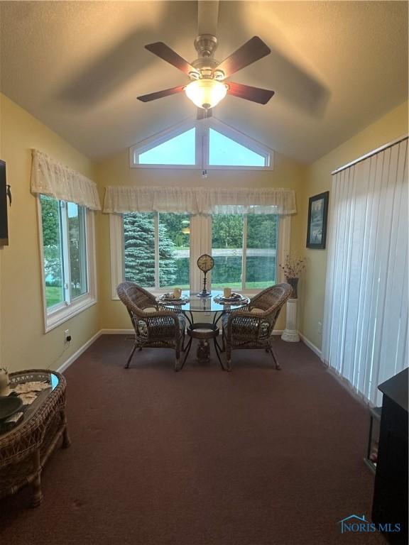 1245 Countryside Dr, Findlay, OH 45840 - dining space with vaulted ceiling, a ceiling fan, baseboards, and dark carpet