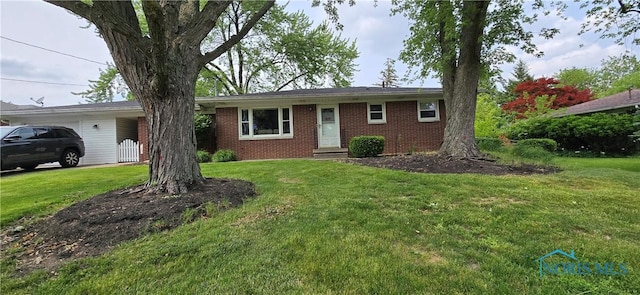 1050 Schreier Rd, Rossford, OH 43460 - ranch-style house featuring brick siding and a front yard
