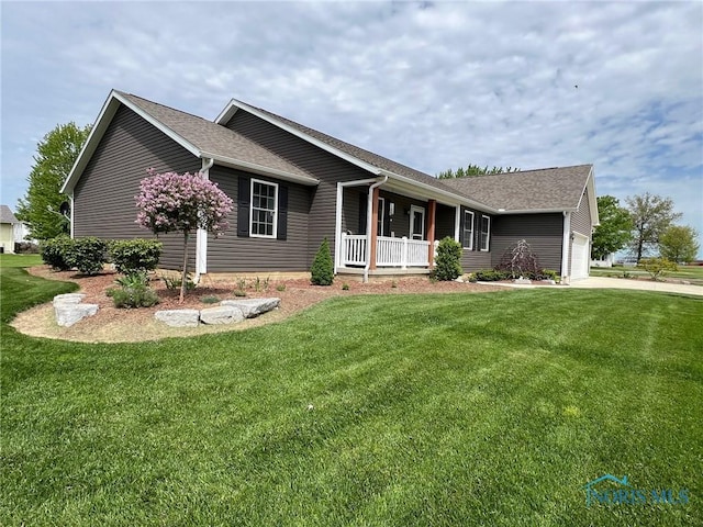 606 Polaris Dr, Upper Sandusky, OH 43351 - ranch-style house with a porch, a front lawn, and an attached garage