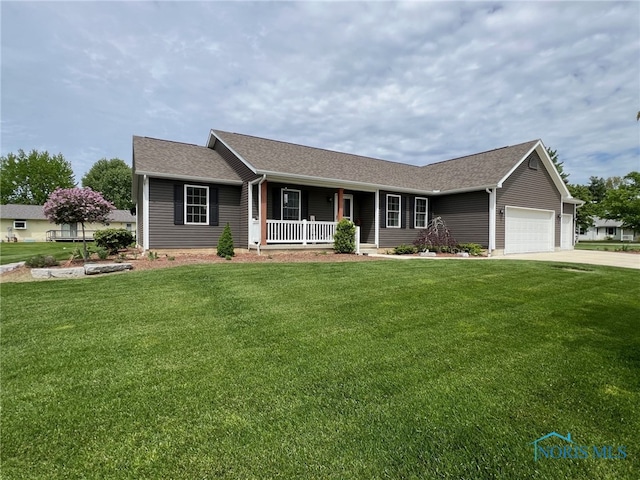 606 Polaris Dr, Upper Sandusky, OH 43351 - ranch-style home featuring covered porch, a front lawn, an attached garage, and concrete driveway