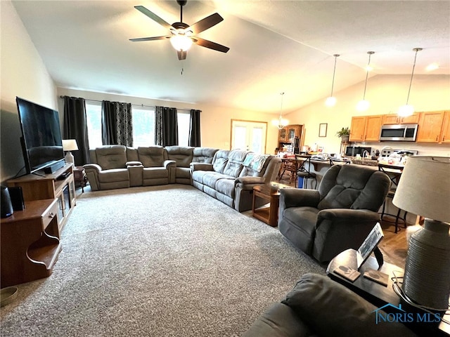 606 Polaris Dr, Upper Sandusky, OH 43351 - carpeted living area featuring vaulted ceiling and ceiling fan