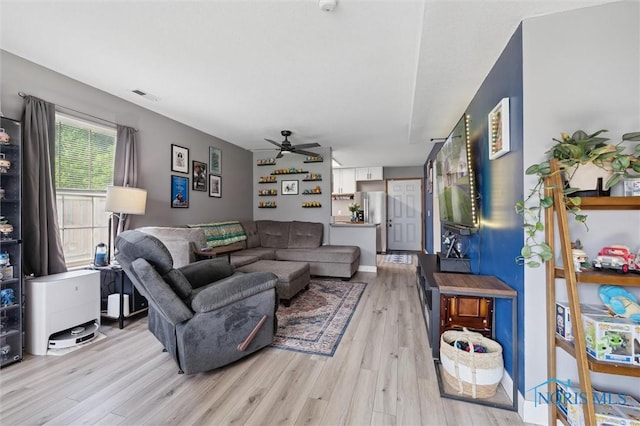 1058 Rockcress Dr, Toledo, OH 43615 - living area with a ceiling fan and light wood-style flooring