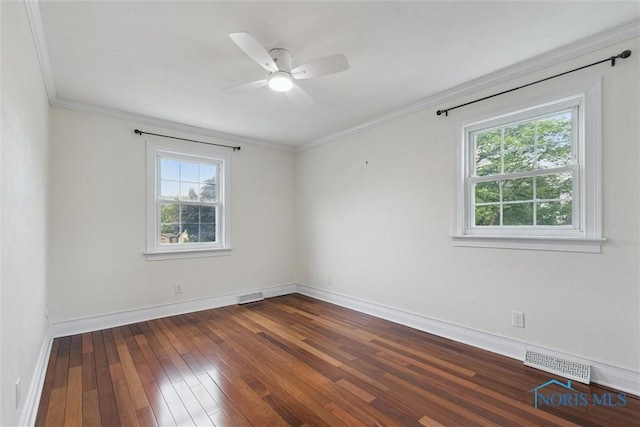 431 Hertford Ct, Maumee, OH 43537 - empty room with plenty of natural light, dark wood finished floors, crown molding, and ceiling fan