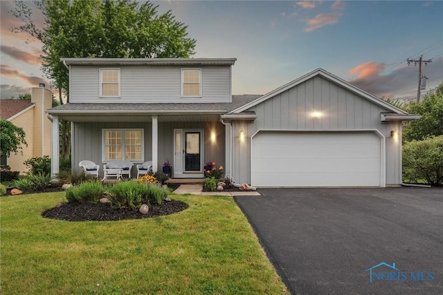 431 Hertford Ct, Maumee, OH 43537 - traditional home with a porch, an attached garage, a front yard, driveway, and a shingled roof