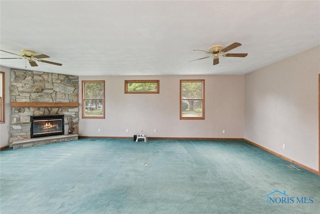 431 Hertford Ct, Maumee, OH 43537 - unfurnished living room featuring ceiling fan, carpet floors, and a fireplace