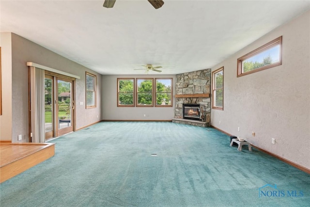 431 Hertford Ct, Maumee, OH 43537 - unfurnished living room featuring ceiling fan, a fireplace, and carpet flooring
