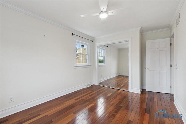 431 Hertford Ct, Maumee, OH 43537 - unfurnished bedroom with hardwood / wood-style flooring, a closet, crown molding, and a ceiling fan