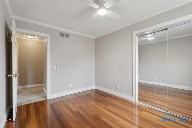 431 Hertford Ct, Maumee, OH 43537 - unfurnished bedroom featuring wood finished floors, a closet, crown molding, and a ceiling fan