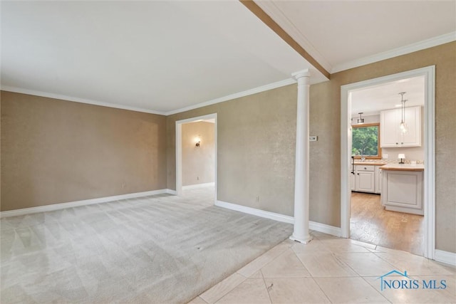 431 Hertford Ct, Maumee, OH 43537 - empty room featuring ornate columns, ornamental molding, and light tile patterned floors