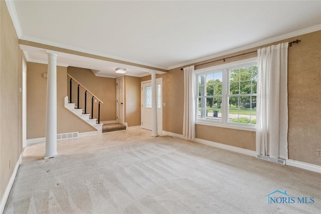 431 Hertford Ct, Maumee, OH 43537 - carpeted foyer featuring healthy amount of natural light, decorative columns, ornamental molding, and stairway