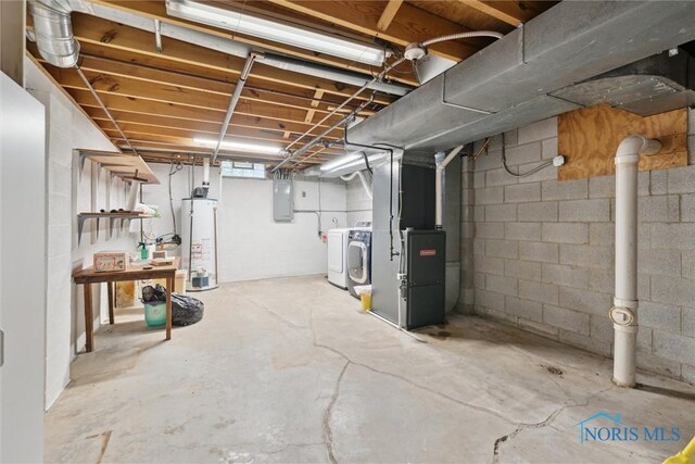 431 Hertford Ct, Maumee, OH 43537 - unfinished basement featuring washing machine and clothes dryer, electric panel, gas water heater, and heating unit