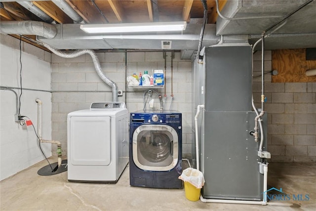 431 Hertford Ct, Maumee, OH 43537 - laundry area featuring separate washer and dryer and heating unit