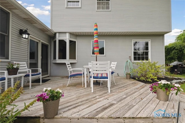 431 Hertford Ct, Maumee, OH 43537 - wooden deck featuring outdoor dining space and a grill