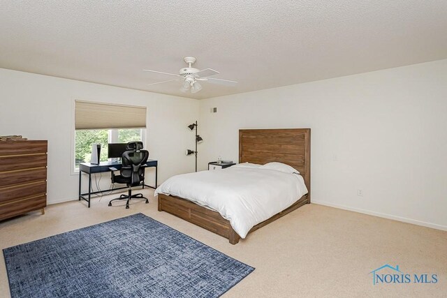 7559 Peachtree Ln, Sylvania, OH 43560 - bedroom with carpet flooring, an office area, a ceiling fan, and baseboards