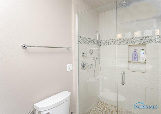 7559 Peachtree Ln, Sylvania, OH 43560 - bathroom with toilet and a shower stall