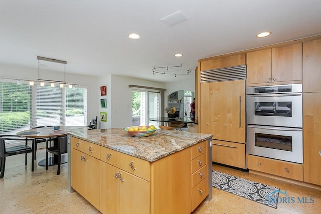7559 Peachtree Ln, Sylvania, OH 43560 - kitchen featuring paneled fridge, double oven, a kitchen island, recessed lighting, and light stone countertops