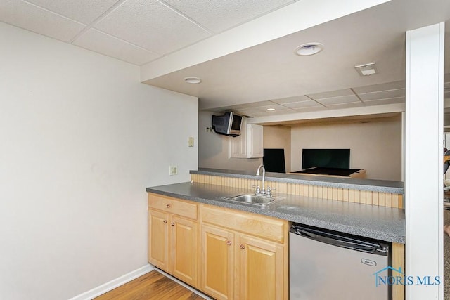 7559 Peachtree Ln, Sylvania, OH 43560 - kitchen with dishwashing machine, a sink, a drop ceiling, light wood-style floors, and light brown cabinets